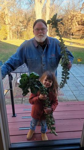 A person and a child standing on a porch AI-generated content may be incorrect.